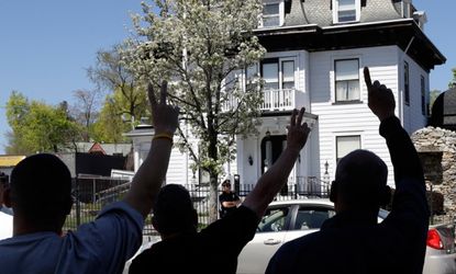 Protesters rally outside the Worcester, Mass., funeral parlor