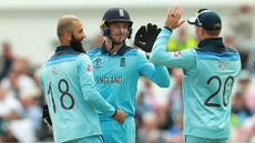 England wicketkeeper Jos Buttler celebrates a wicket with Moeen Ali and Jason Roy