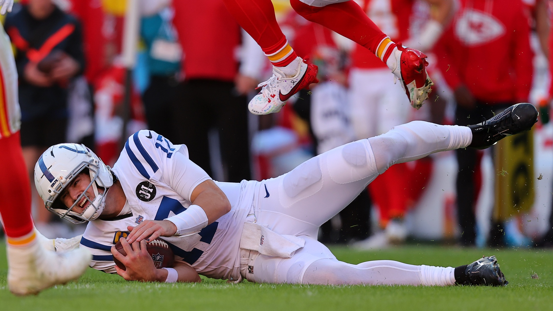 Indianapolis Colts quarterback Daniel Jones sliding after a scramble against the Kansas City Chiefs