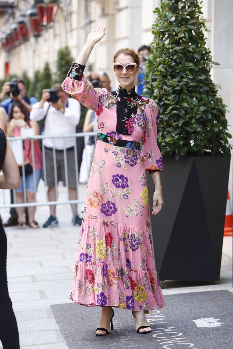 Just one day later, she went for it in another head-to-toe Gucci outfit. This time, a pink floral dress and strappy heeled sandals.