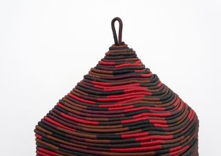Stephen Burks spirit house wrapped with red rope