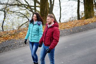 A couple taking an autumn walk.