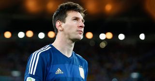 Lionel Messi of Argentina looks on after being defeated by Germany 1-0 during the 2014 FIFA World Cup Brazil Final match between Germany and Argentina at Maracana on July 13, 2014 in Rio de Janeiro, Brazil.