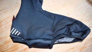 Castelli Estremo overshoe on a wooden table