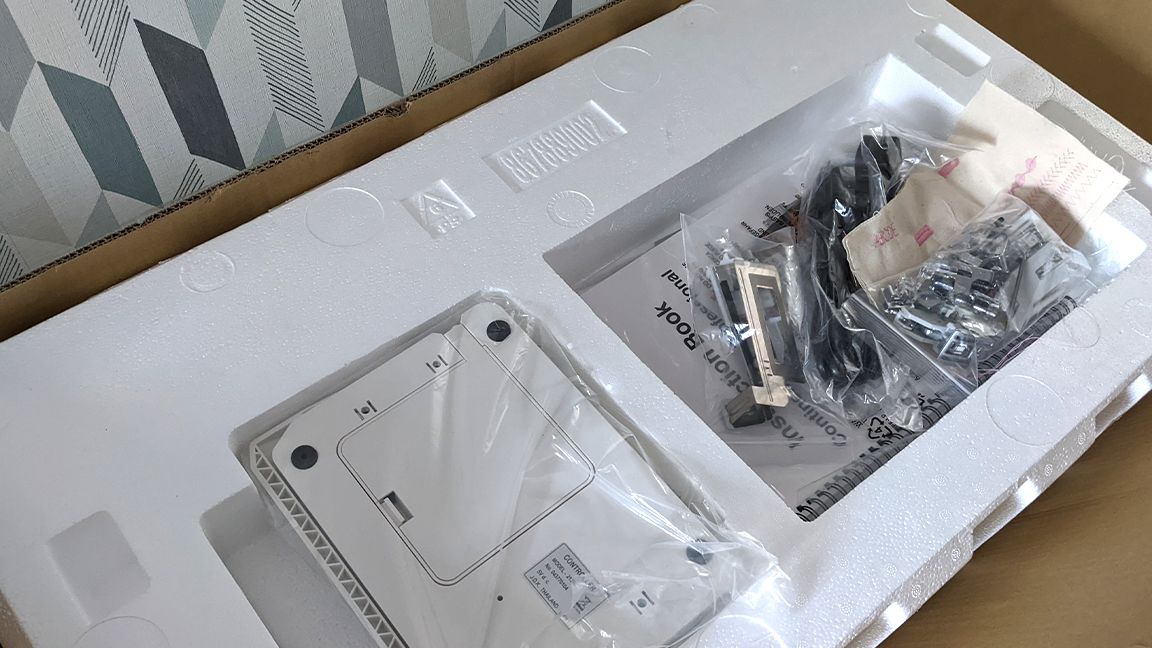 Janome Continental M7 review, a photo of a sewing machine in a box