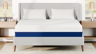 Best mattress for side sleepers: image shows the Amerisleep AS3 hybrid mattress placed on a light grey bedframe in a white bedroom