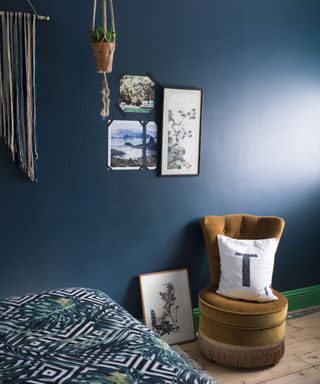 bedroom with blue wall and wooden flooring