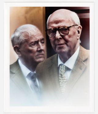 Gilbert & George in suits photographed side by side