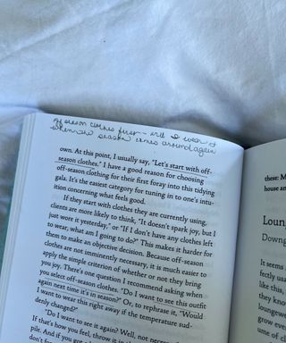 An annotated page of a book on white bedsheets