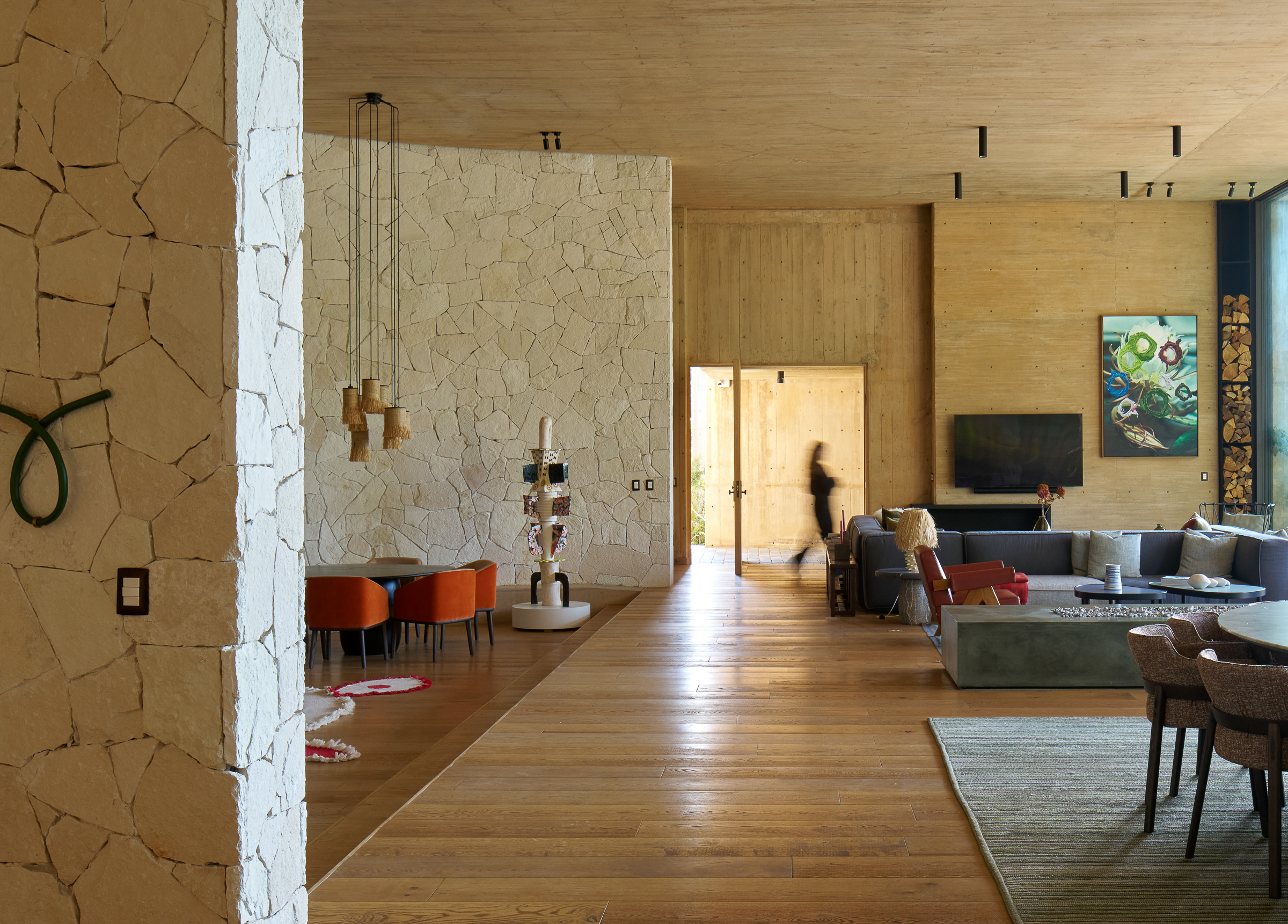 Inside the main living area, with curved stone walls concealing service spaces