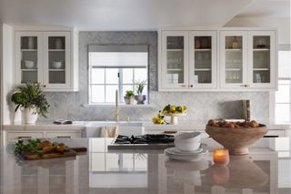 White kitchen with white zellige herringbone tile splashback