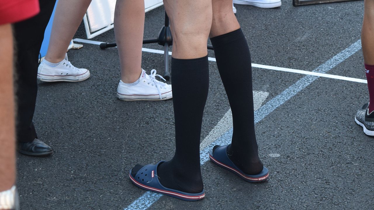 Several riders opt to wear compression socks ahead of stage starts throughout the week