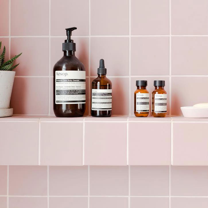 bathroom with handwash bottle and open titles