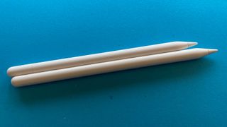 Apple Pencil USB-C and Apple Pencil 2 on a blue background