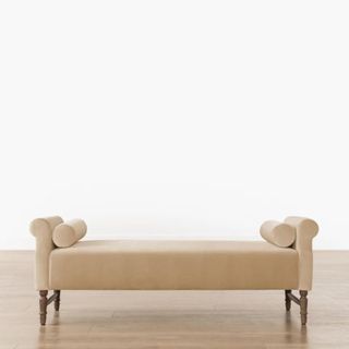 A tan bench with two small pillows from McGee & Co.