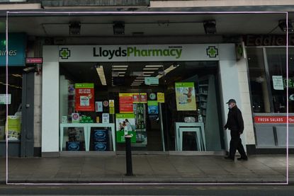 a close up of a Lloyds Pharmacy store on the high street at risk of closing down