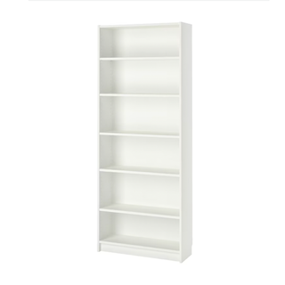 A tall white wooden bookshelf