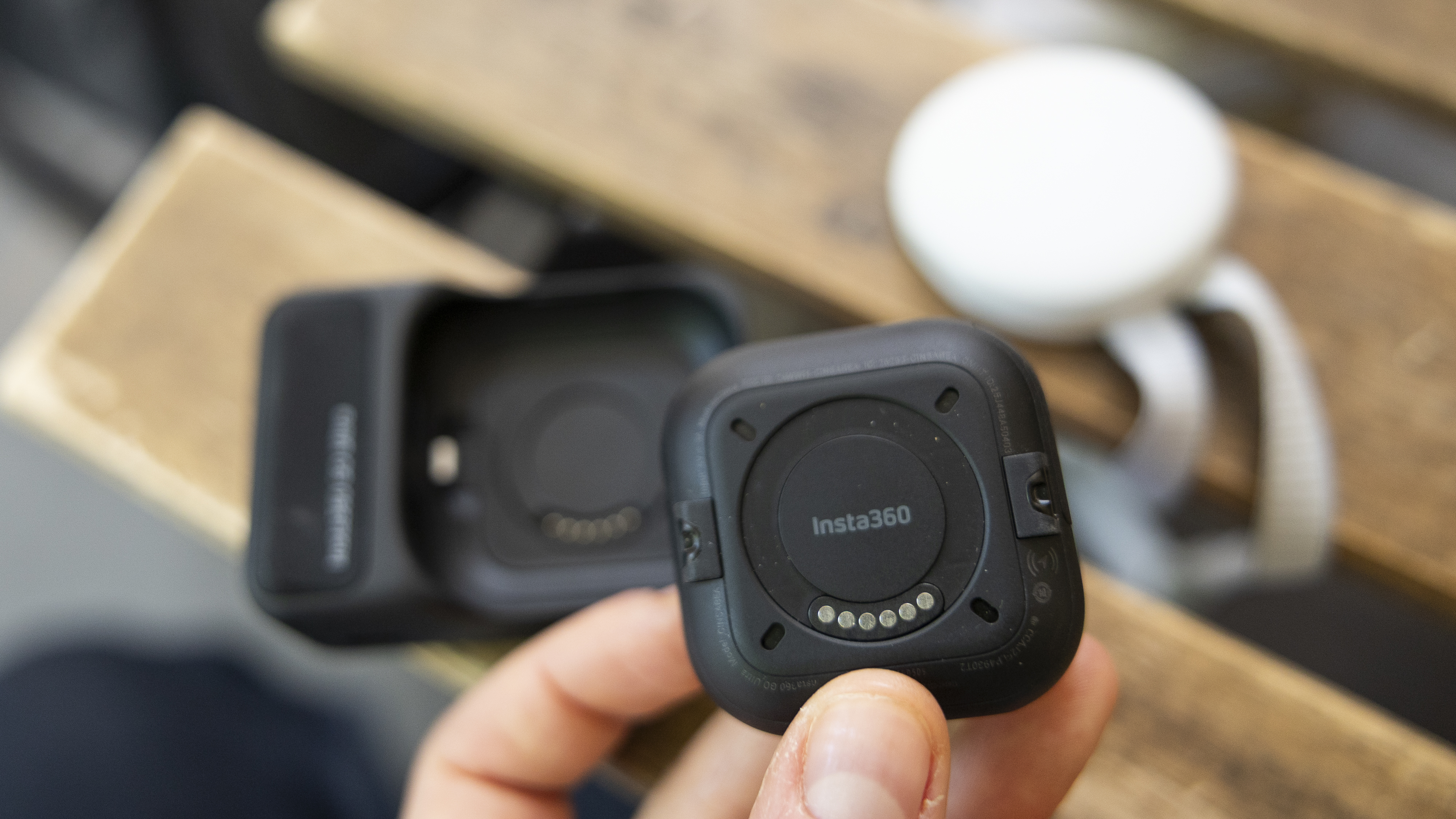 A close-up showing the magnetic mount on Insta360 GO Ultra camera