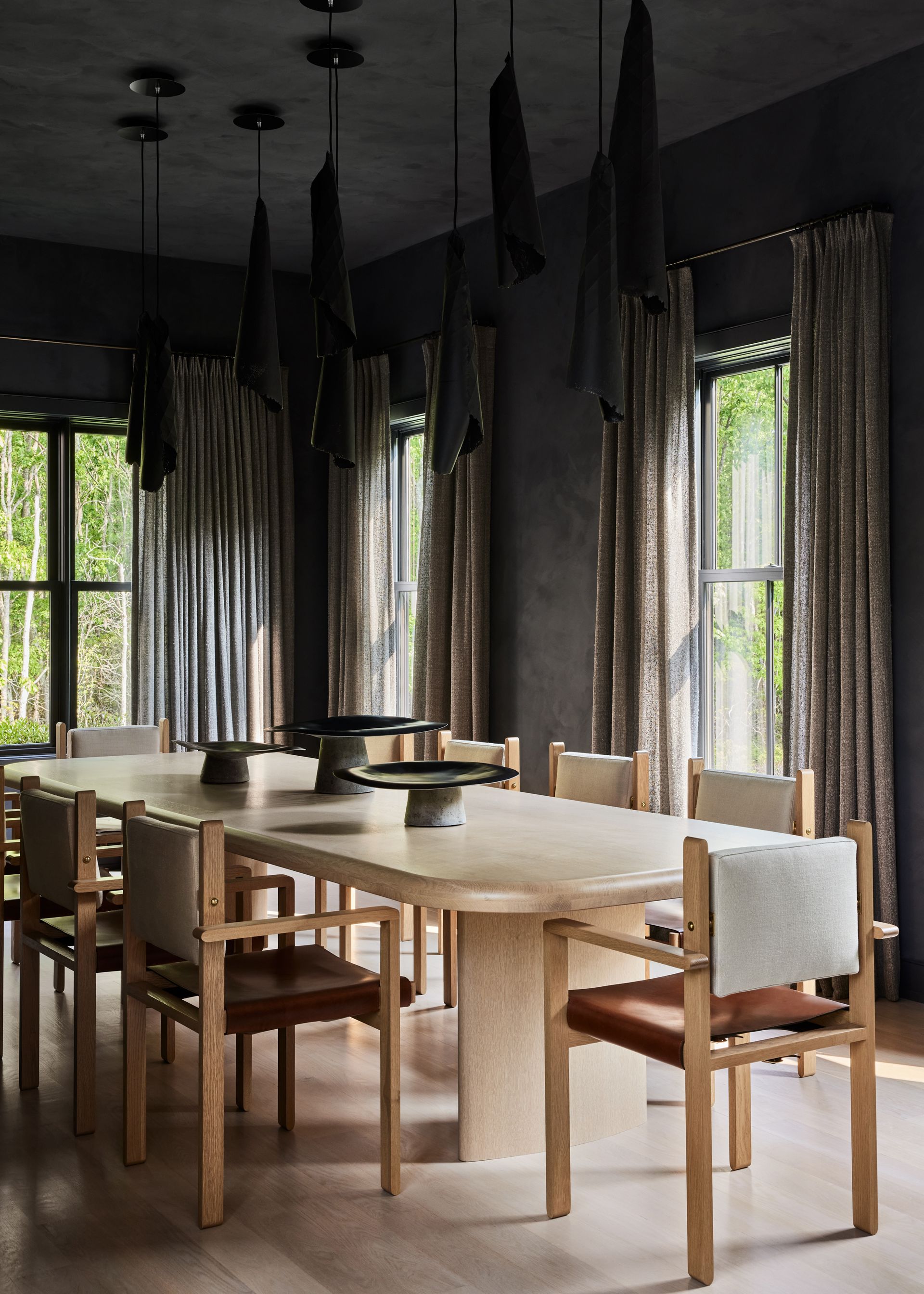 A dining room with well-hung curtains