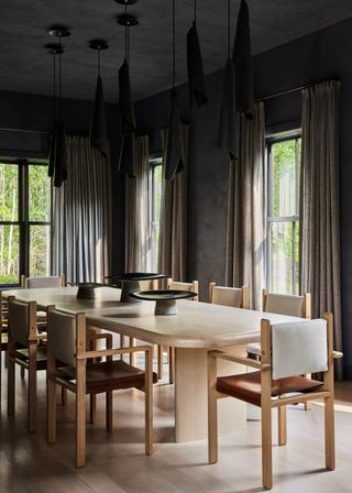 A dining room with well-hung curtains