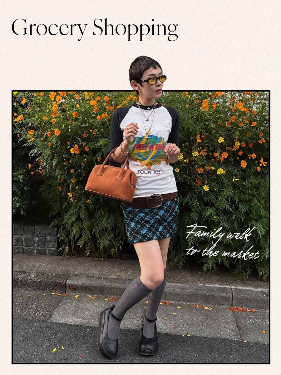 Woman in graphic long sleeve tee and plaid mini skirt