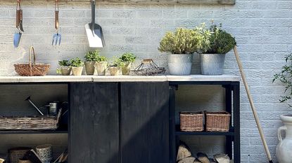 garden potting station with plant pots and tools