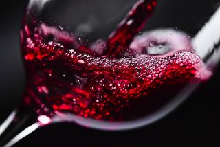 A wine glass is shown closeup.