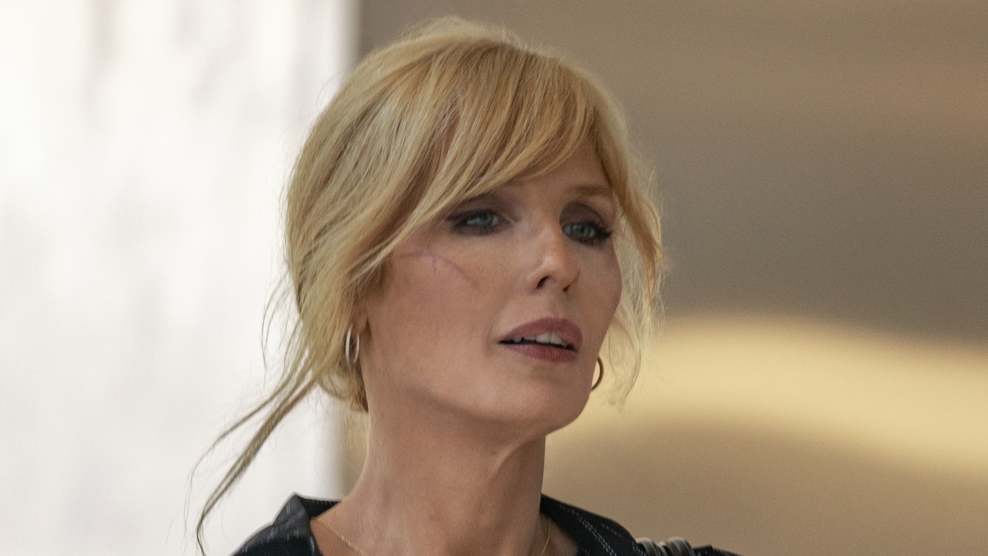 Close-up of Beth Dutton's face as she talks with Beulah Jackson in Dutton Ranch