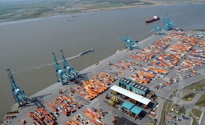 Birds eye view of cargo yard next to water