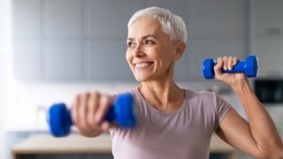 a senior woman exercising with dumbbells
