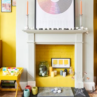 room with yellow brick wall and fire place