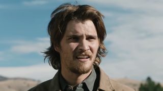 Kayce Dutton standing outside being chastised by Rip in Yellowstone