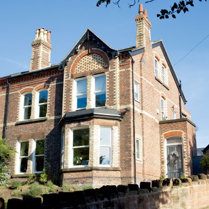 exterior with brick wall and glass window