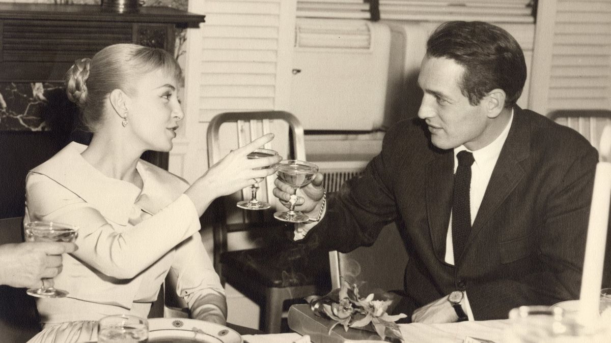 Joanne Woodward and Paul Newman making a toast