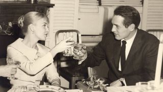 Joanne Woodward and Paul Newman making a toast