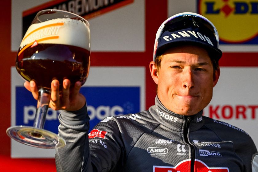 Alpecin-Deceuninck team Belgium&#039;s Jasper Philipsen celebrates on the podium after winning the Kuurne-Brussels-Kuurne one day cycling race, 196,9 km from Kuurne to Kuurne via Brussels, on March 2, 2025. (Photo by ERIC LALMAND / Belga / AFP) / Belgium OUT