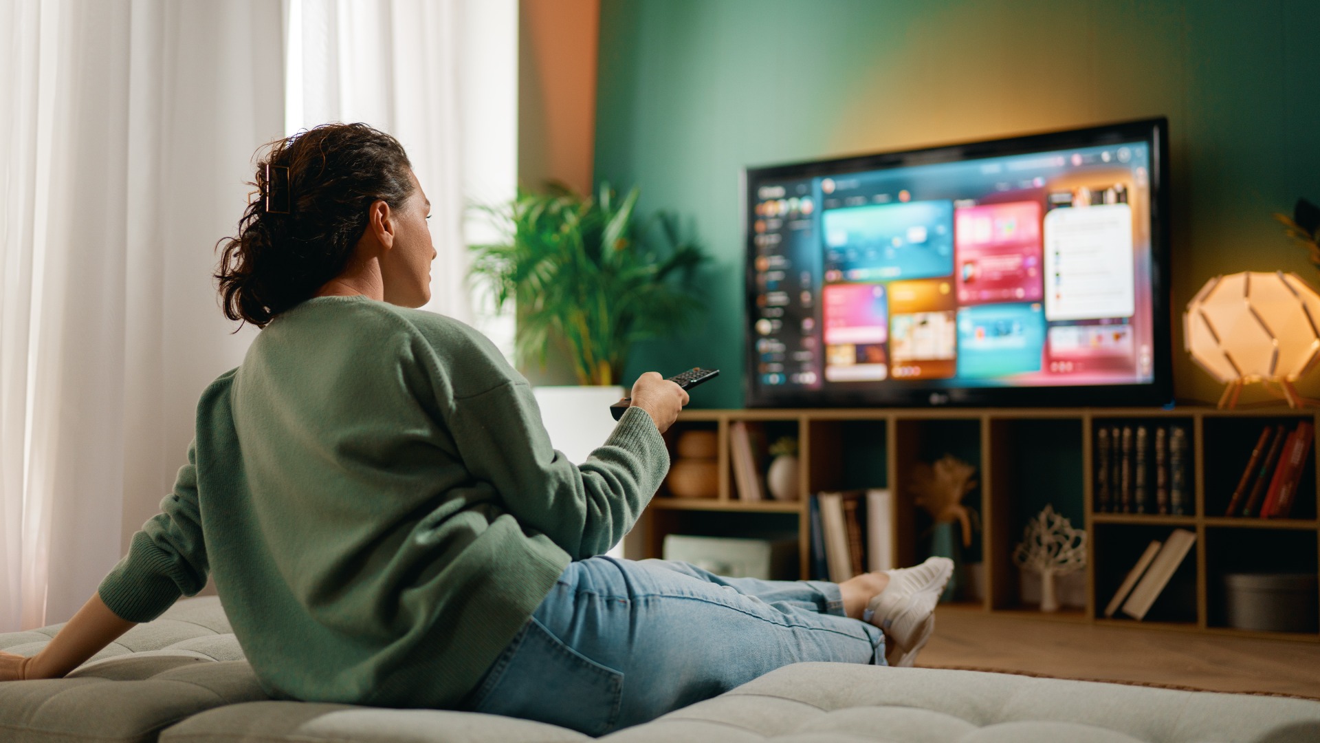 Woman on the sofa watching TV