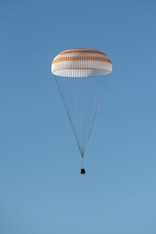 A Russian Soyuz TMA-11M spacecraft is seen as it lands with Expedition 39 Commander Koichi Wakata of the Japan Aerospace Exploration Agency (JAXA), Soyuz commander Mikhail Tyurin of Roscosmos, and Flight Engineer Rick Mastracchio of NASA near the town of