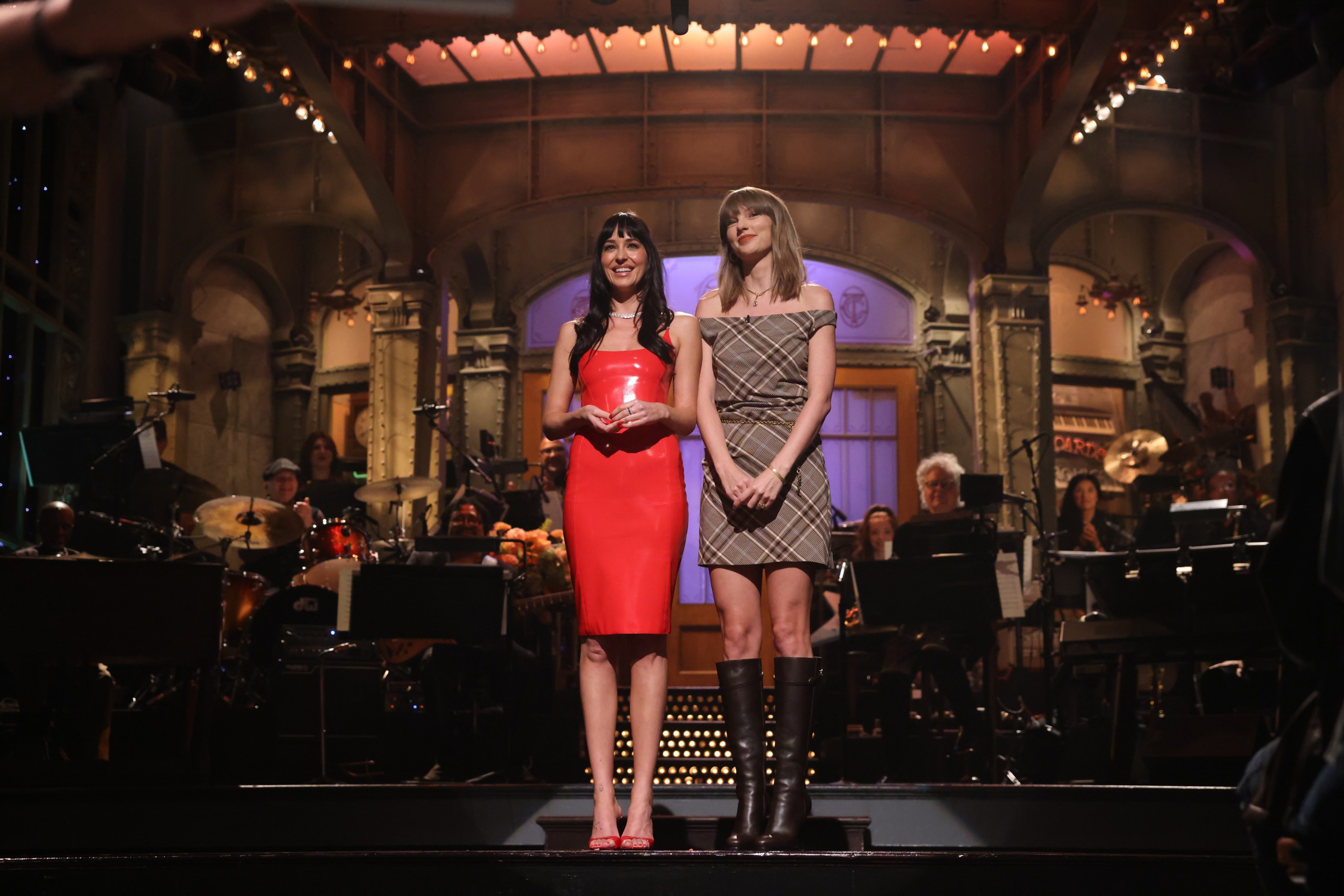 Taylor Swift appears on SNL wearing a plaid mini dress from Simkhai