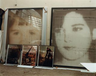 In Boltanski’s studio, large prints on veil from his Après series, alongside three small lenticular prints from his Signal series
