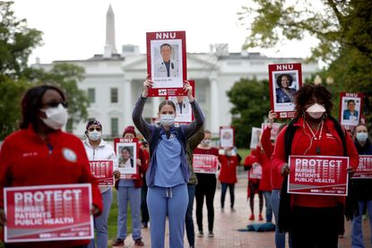 Nurses protest outside the White House.
