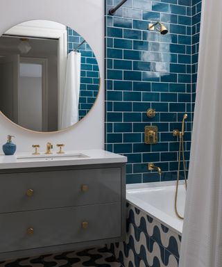 Blue bathroom in a light filled 1930s home with clever use of pattern