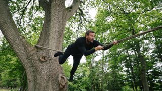 How to stay calm under pressure: ex-special forces soldier and survival expert Ollie Ollerton crawls across a suspended rope bridge during a survival exercise