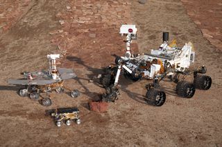 This grouping of two test rovers and a flight spare provides a graphic comparison of three generations of Mars rovers developed at NASA's Jet Propulsion Laboratory, Pasadena, Calif. The setting is JPL's Mars Yard testing area. Front and center is the flight spare for the first Mars rover, Sojourner, which landed on Mars in 1997 as part of the Mars Pathfinder Project. On the left is a Mars Exploration Rover Project test rover that is a working sibling to Spirit and Opportunity, which landed on Mars in 2004. On the right is a Mars Science Laboratory test rover the size of that project's Mars rover, Curiosity, which is on course for landing on Mars in August 2012.
