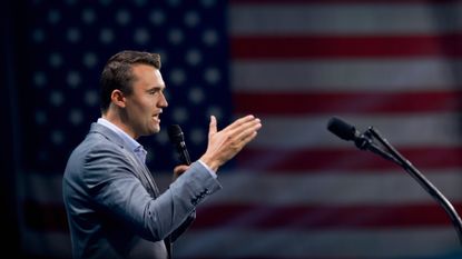 Charlie Kirk welcomes Donald Trump to the stage at a Turning Point USA Believers Summit