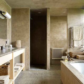 main bathroom with tadelakt plaster finish and travertine