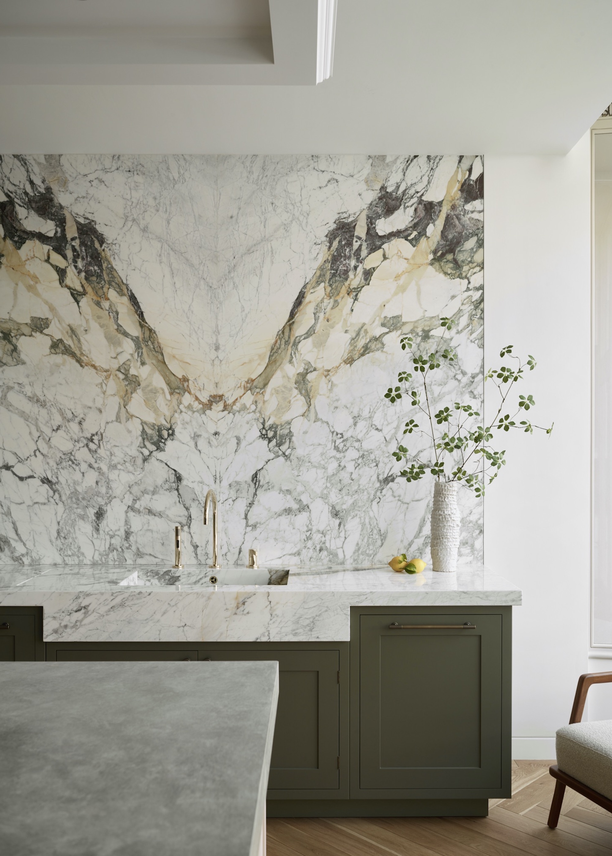 kitchen with bookmatched marble splashback