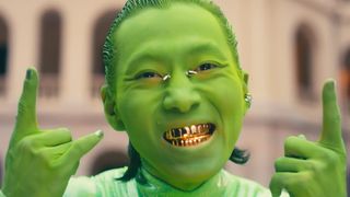 A person painted green as an alien in a Hong Kong Ballet video