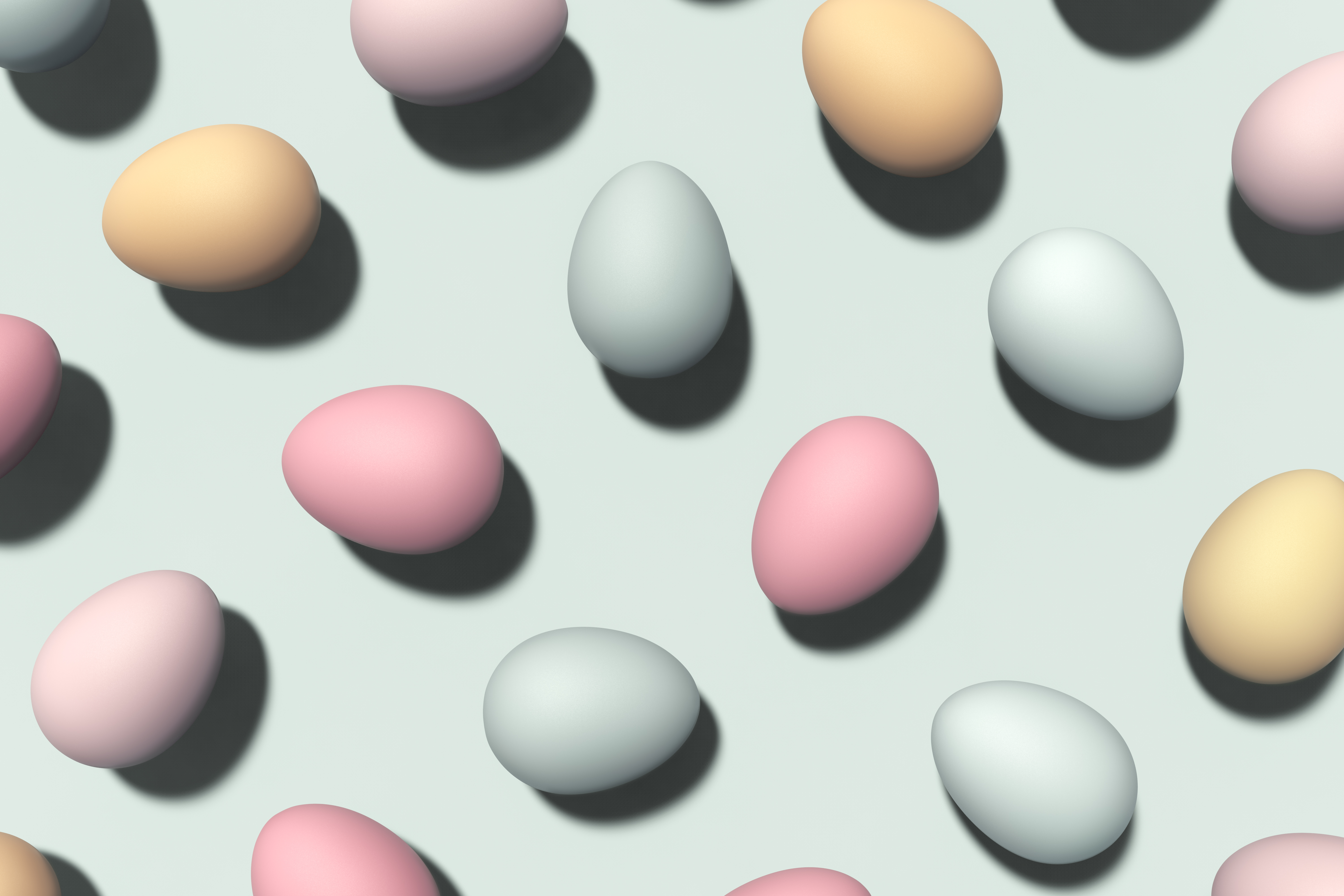 Flatlay of pastel eggs on a pale blue background
