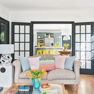 living room with white wall and internal black door